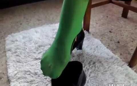 Green pantyhose soles with black ankle boots